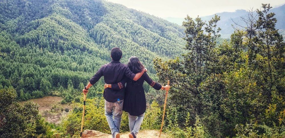 Couple standing back